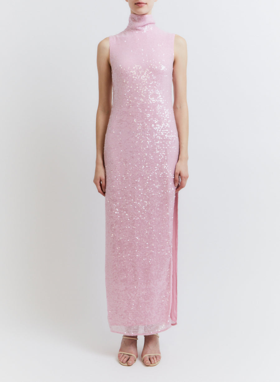 This maxi dress has sequin detailing, a high neckline, and a slit down the leg. 