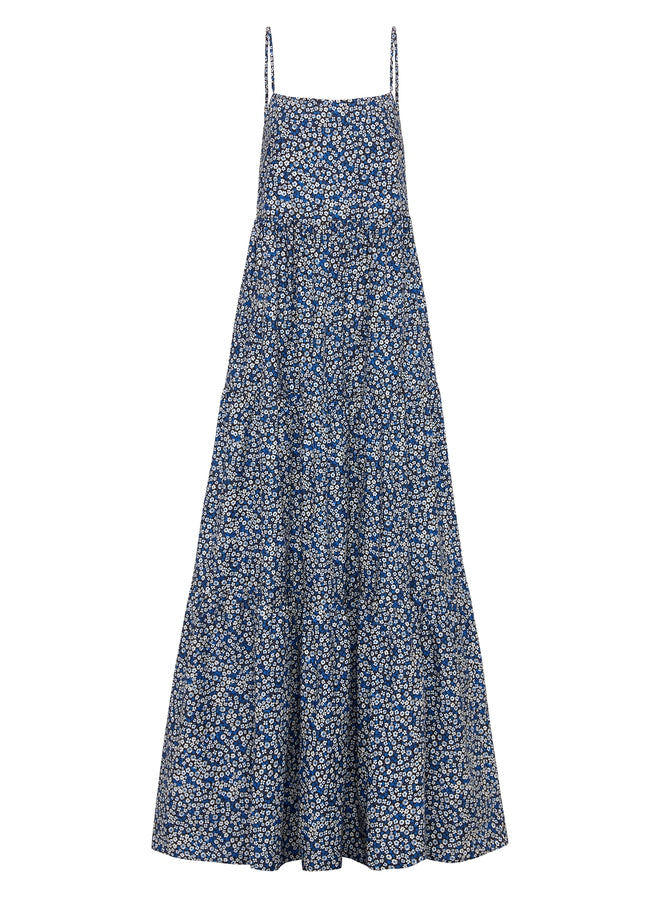 This sundress features delicate straps, functional side pockets, and a low scooped back.