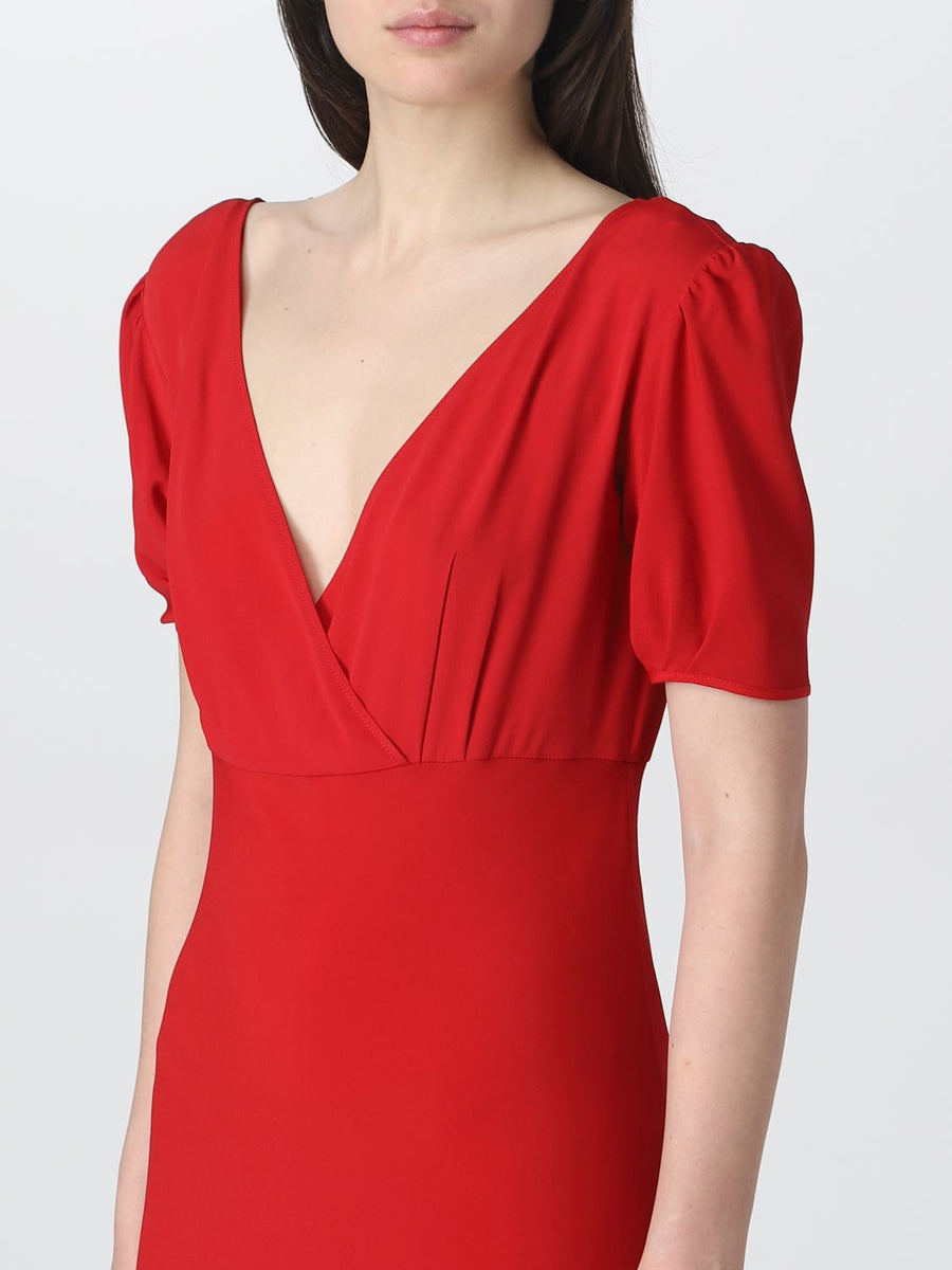 Midi Dress. V-neckline with ruffles at the sleeves. Ties at the back.