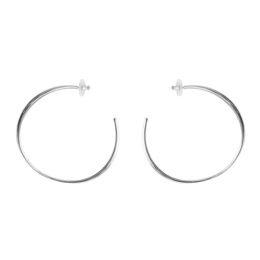 Signature to Lisa's collection the 'Gaby' earring has an organic feel that still reads sophisticated. A simple post-closure and unique shape give a fresh take on the classic hoop. Here, in our largest size offering. 