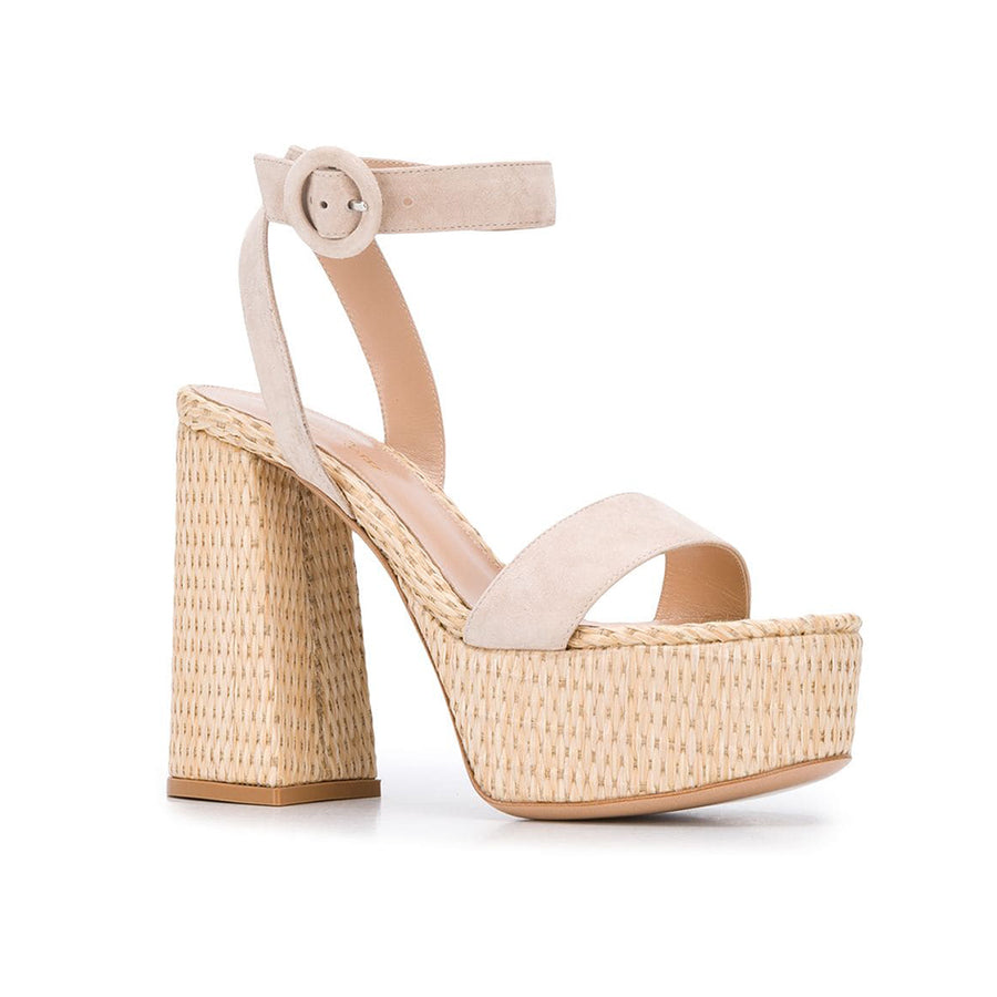 The 'Zandra' here features a raffia platform sole, paired with soft neutral suede. The maxi platform block heel has an ever-so-slight flare to its shape, that holds tribute to iconic 1970's fashion. 