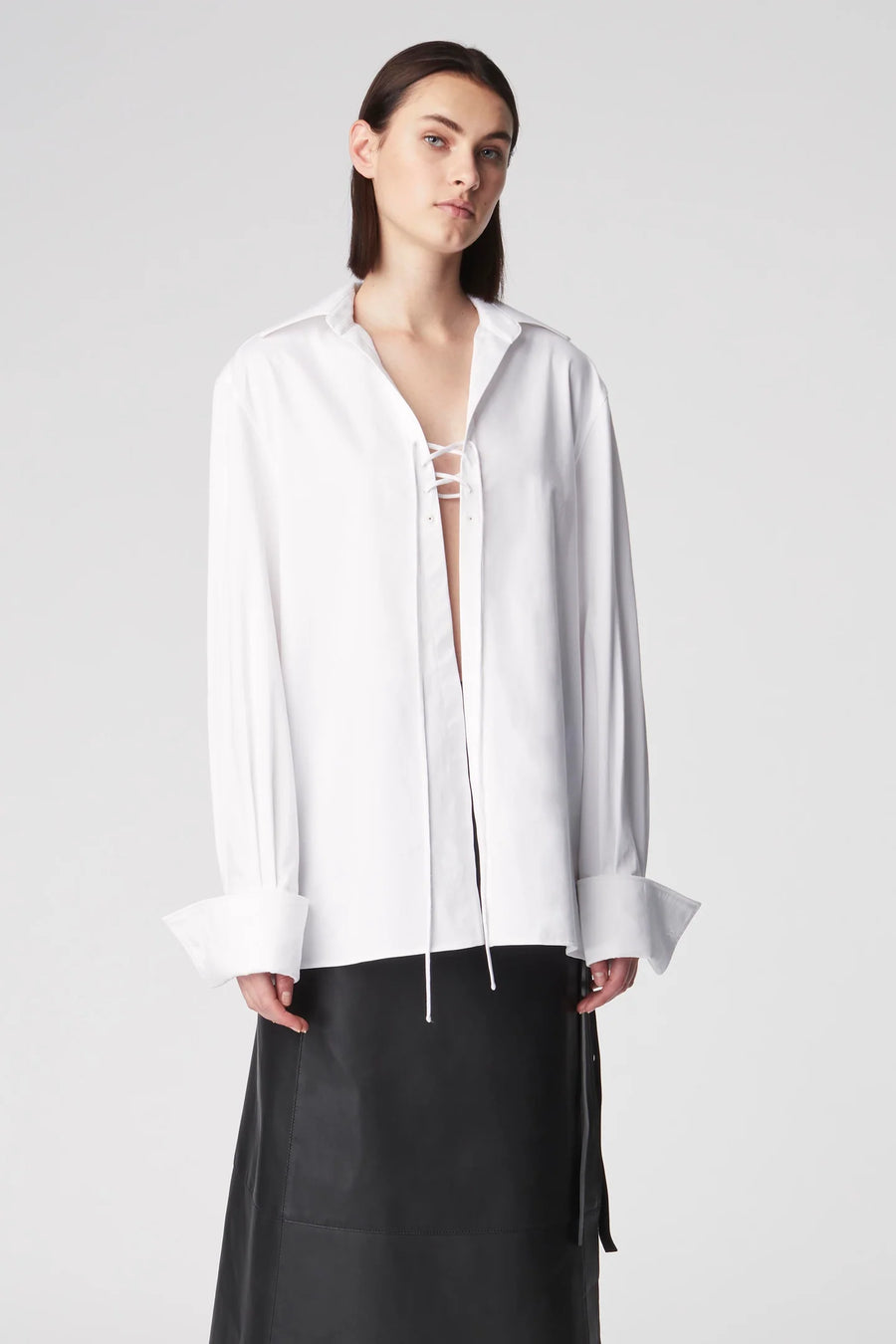 Oversized blouse featuring tie detailing at the chest and a wide collar. 