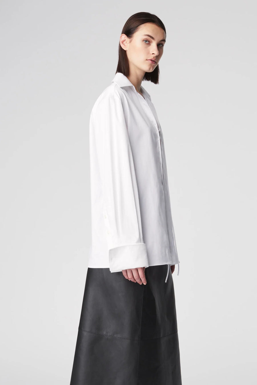 Oversized blouse featuring tie detailing at the chest and a wide collar. 