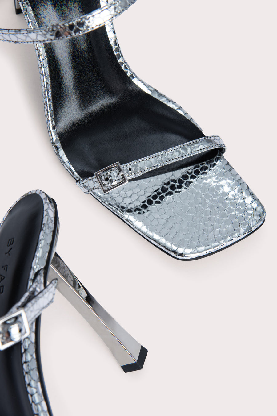 Slip these on and your outfit is instantly elevated. The 'Flick' heel is crafted from a silver flagstone leather and has mini buckles that can be adjusted. Pair with a frayed straight leg denim and a bustier to complete the look.