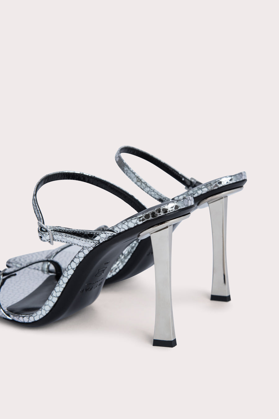 Slip these on and your outfit is instantly elevated. The 'Flick' heel is crafted from a silver flagstone leather and has mini buckles that can be adjusted. Pair with a frayed straight leg denim and a bustier to complete the look.