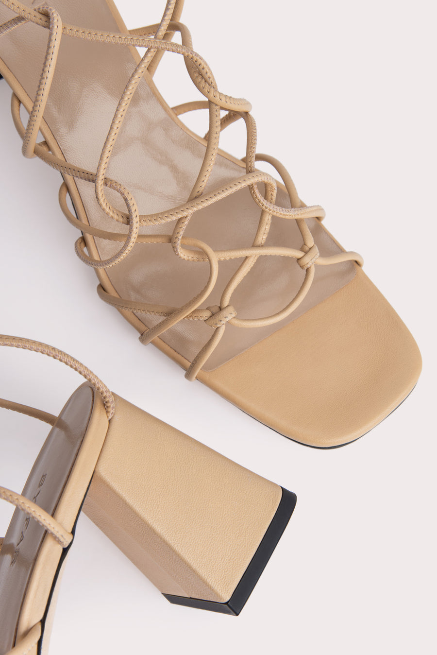The 'Alexander' sandal. Made from soft Nappa leather woven and knotted. Rounded toe. 