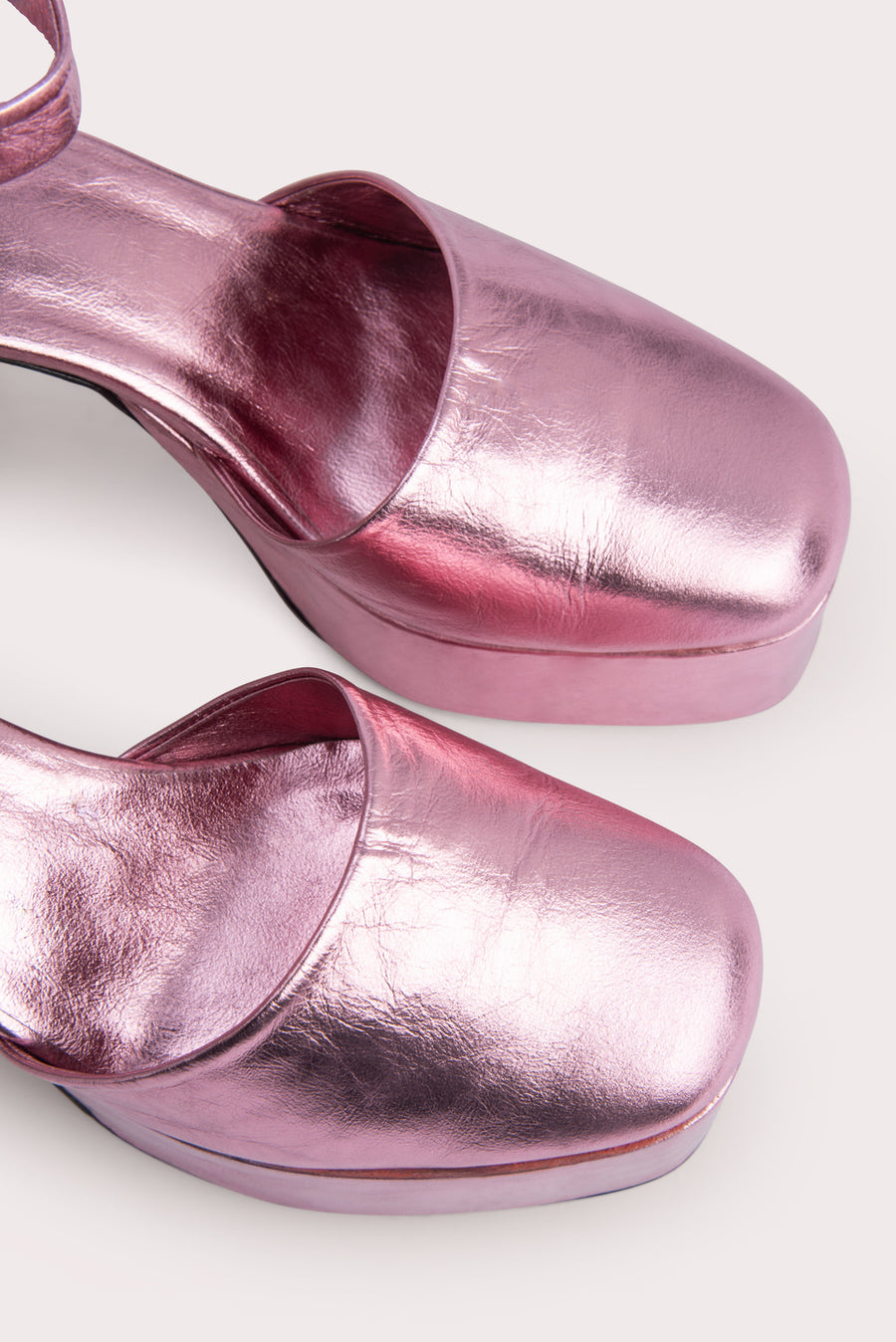 The 'Barb' platform pump. Standing tall on a 12cm block heel in metallic leather. Rounded toe, adjustable ankle strap. 