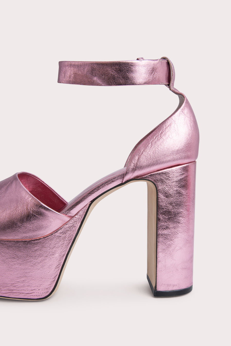 The 'Barb' platform pump. Standing tall on a 12cm block heel in metallic leather. Rounded toe, adjustable ankle strap. 