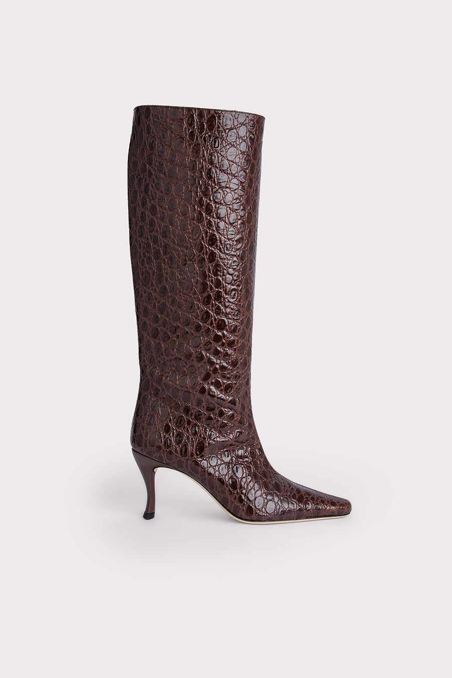 The 'Stevie' 42 are the ultimate shaft boot for this season. Made with a croc-embossed leather, they finish below the knee adding a vintage vibe and slope into a pointed toe, set on an angular heel. Pair with a midi dress for a bohemian look. 
