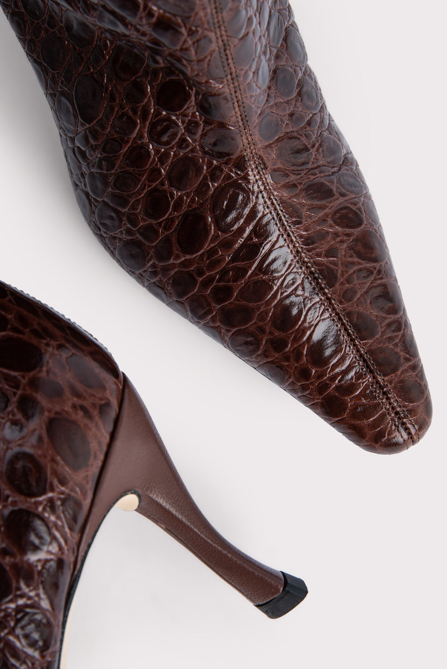The 'Stevie' 42 are the ultimate shaft boot for this season. Made with a croc-embossed leather, they finish below the knee adding a vintage vibe and slope into a pointed toe, set on an angular heel. Pair with a midi dress for a bohemian look. 