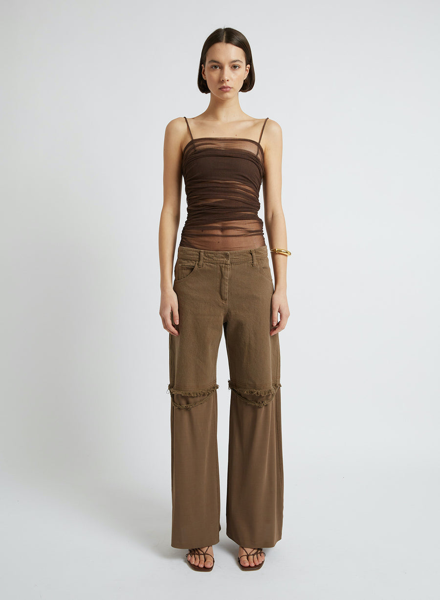 These deconstructed jeans crafted from rich, walnut washed cotton will be your new best friend this season. Featuring its mid-rise and wide leg silhouette, these jeans would pair perfectly with just about anything, making them a must for your wardrobe. 