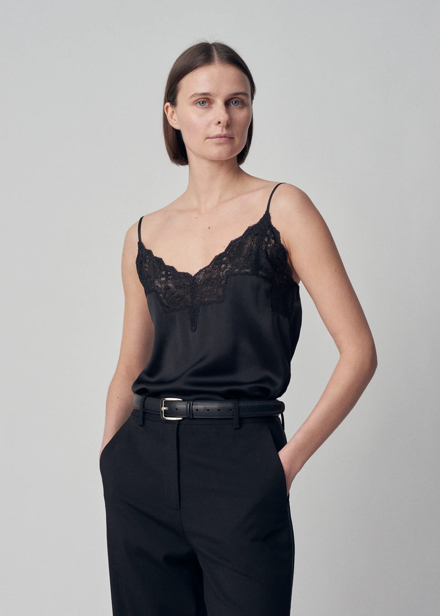 A v-neck bias cut silk camisole with lace trim at neckline and adjustable straps.