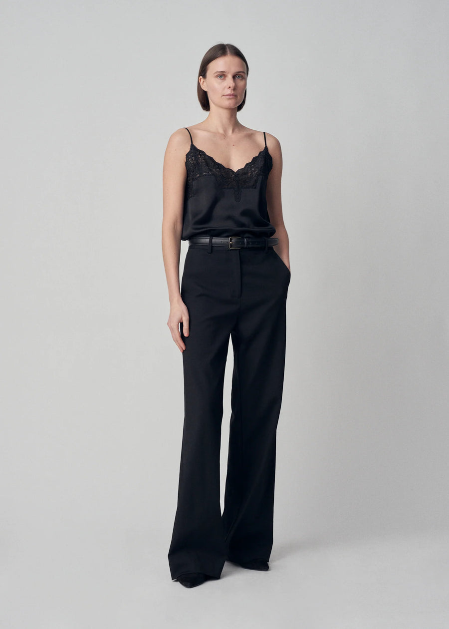 A v-neck bias cut silk camisole with lace trim at neckline and adjustable straps.