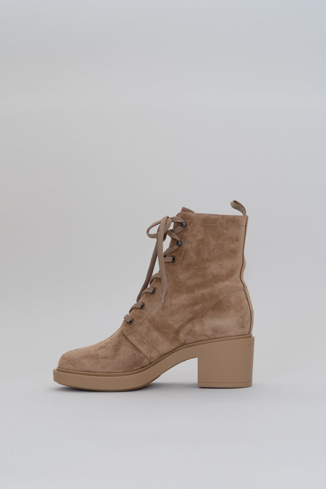 The 'Foster' ankle boots subtly channel traditional combat styles. Made in Italy from supple suede, they have rounded toes and lace-up through the front. They're stacked on a chunky 45mm heel that'll keep you stable and comfortable while adding a little height.