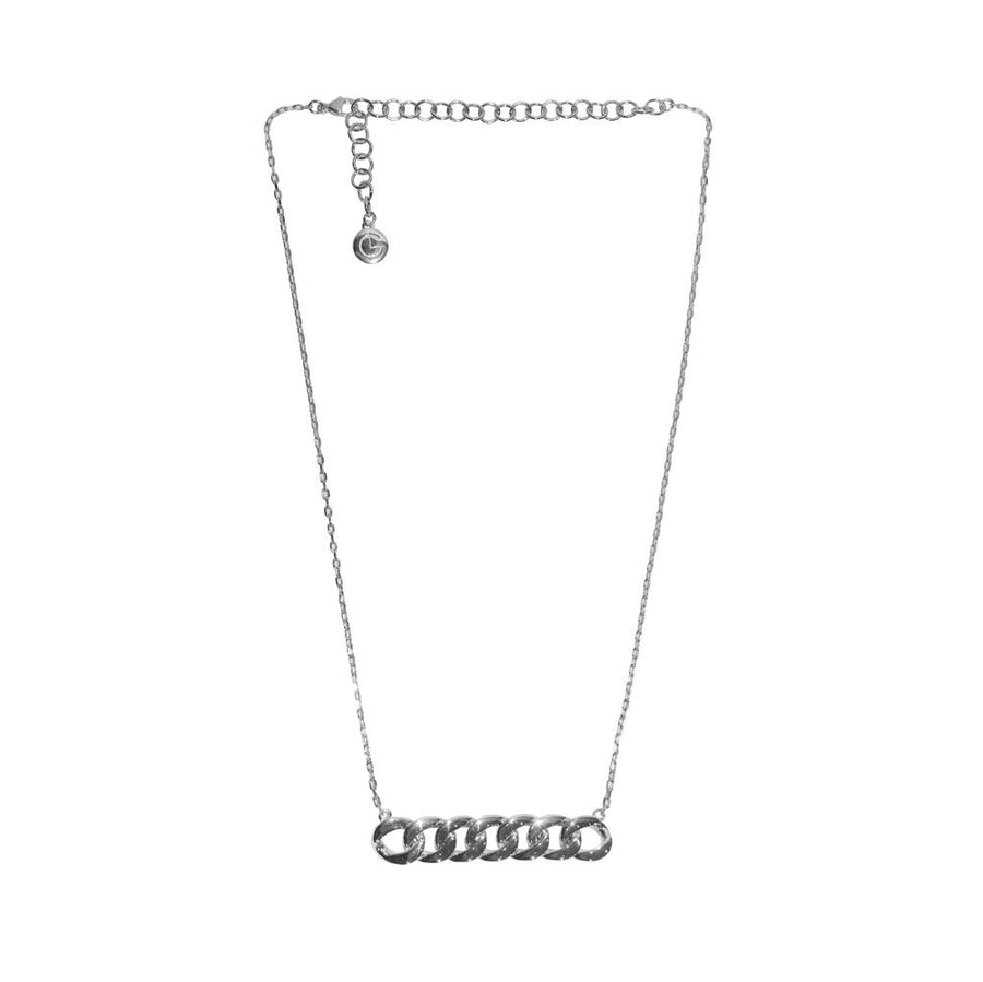 The 'Holly' necklace has a lighter feel to it. A vertical bar of links sits stationary as a pendant on a super-fine chain. We love it styled with a white t-shirt on its own, but it's perfect for layering, too. An extra-long extension allows you to play with length.