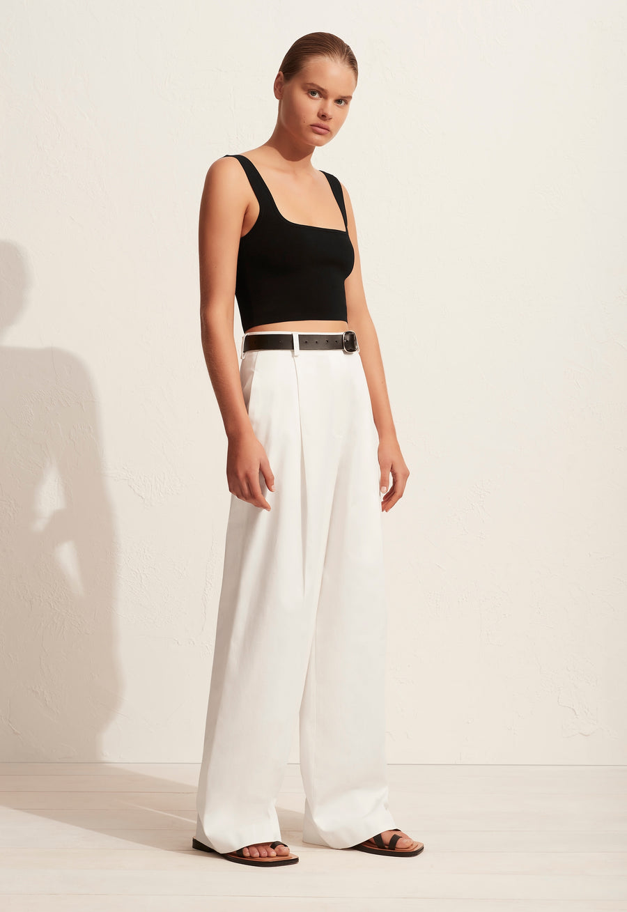 The 'Nineties Crop Top' is a square neck knitted cropped tank with slim straps. Its vintage vibe and simple silhouette make this top an easy wardrobe essential.