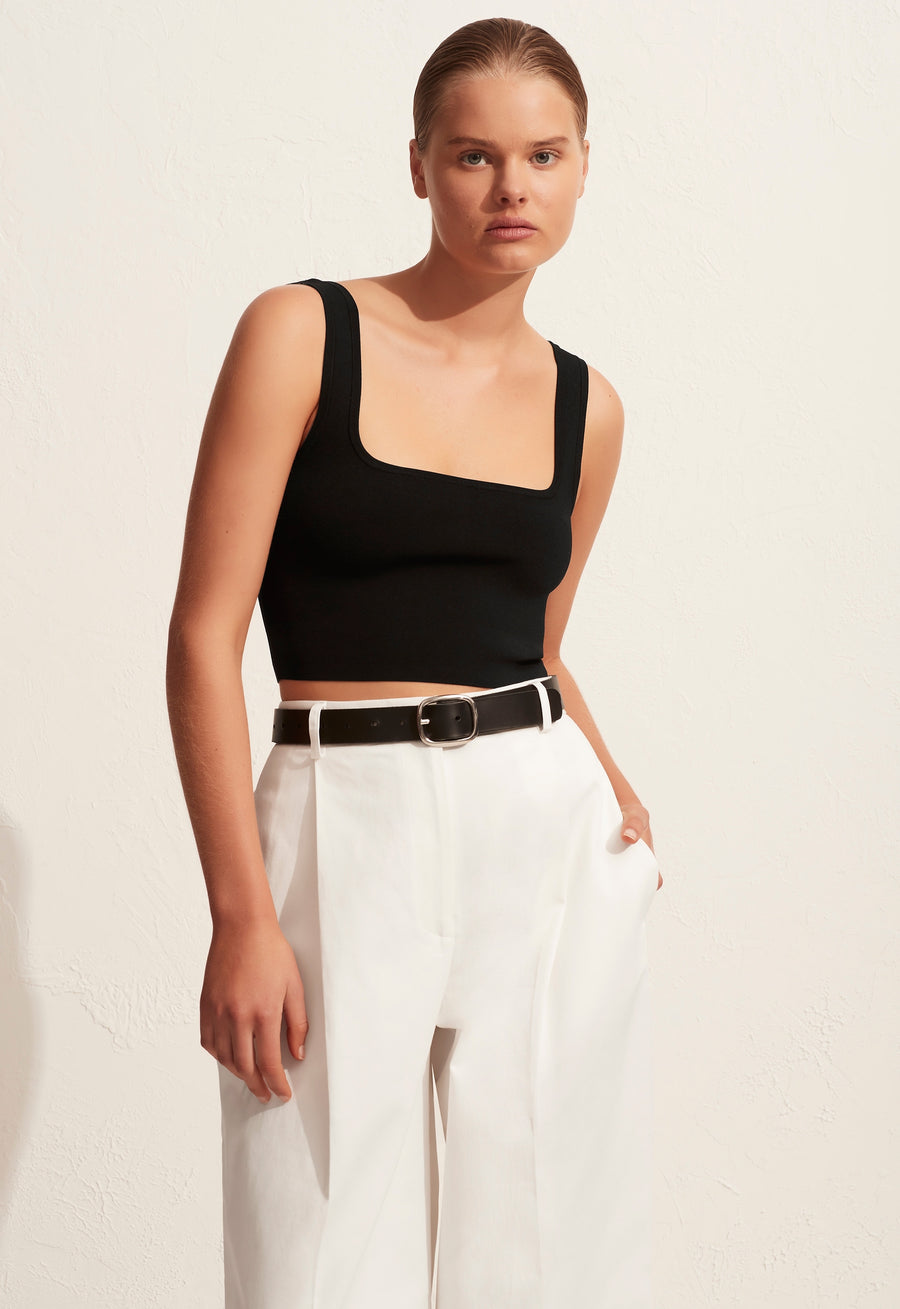 The 'Nineties Crop Top' is a square neck knitted cropped tank with slim straps. Its vintage vibe and simple silhouette make this top an easy wardrobe essential.