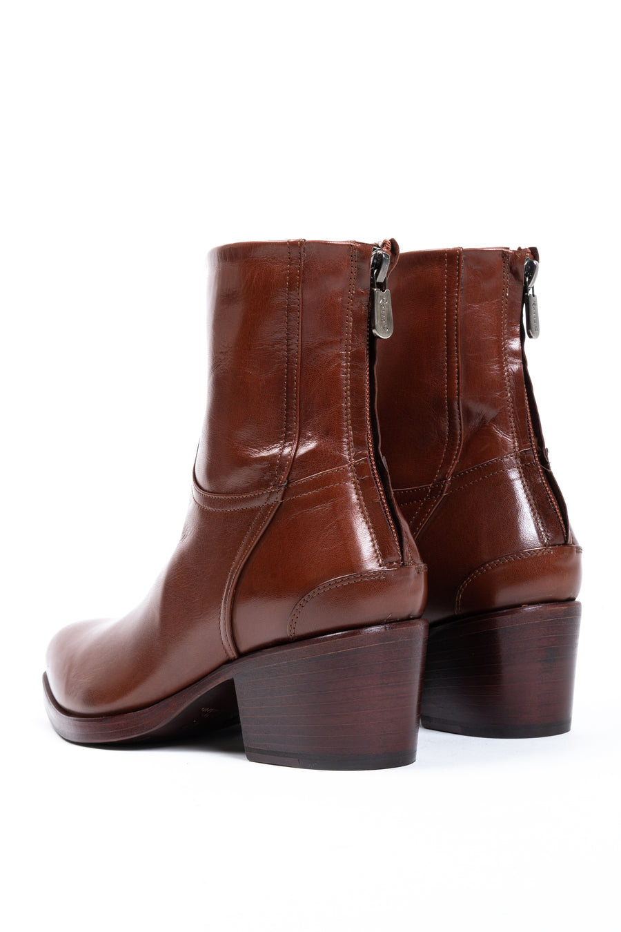 Join the cult following of Rocco P. lovers. This new silhouette offers a subtly squared toe, and a back zipper closure. Featured here in rich, cognac-hued leather, with a tonal sole.