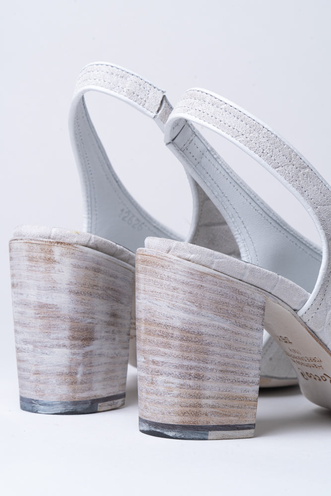 A best-selling shape from Rocco, the criss-cross sandal returns. Featured here in a stunning stone grey, stamped suede and tonal leather heel, and sole. 