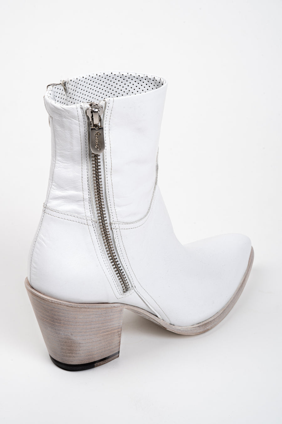 Join the cult following of Rocco P. lovers. Our #1 bestseller, it's the ultimate luxe basic. Rocco's classic last with double zip closure, available here in a crisp, optic white leather. 